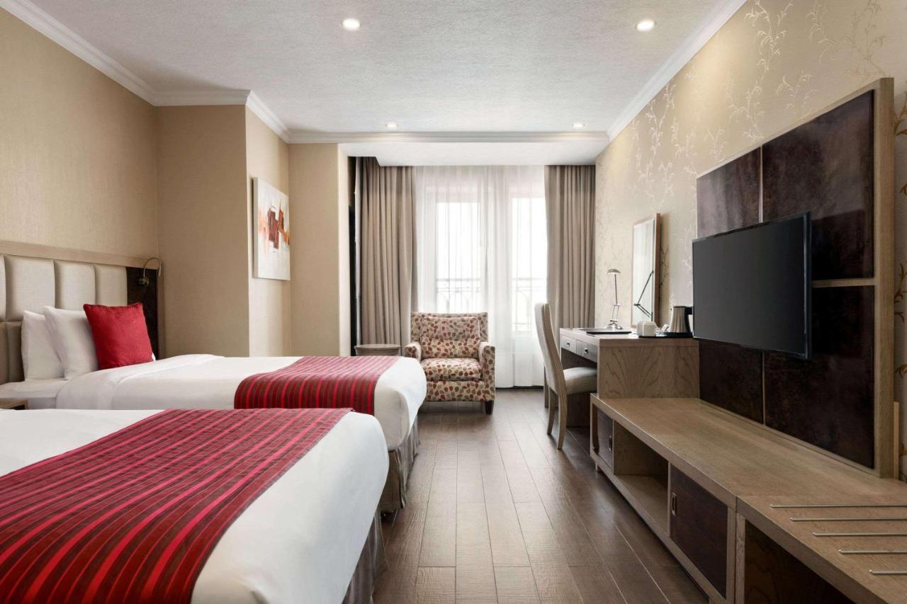 Ramada By Wyndham Bishkek Centre Hotel Exterior photo