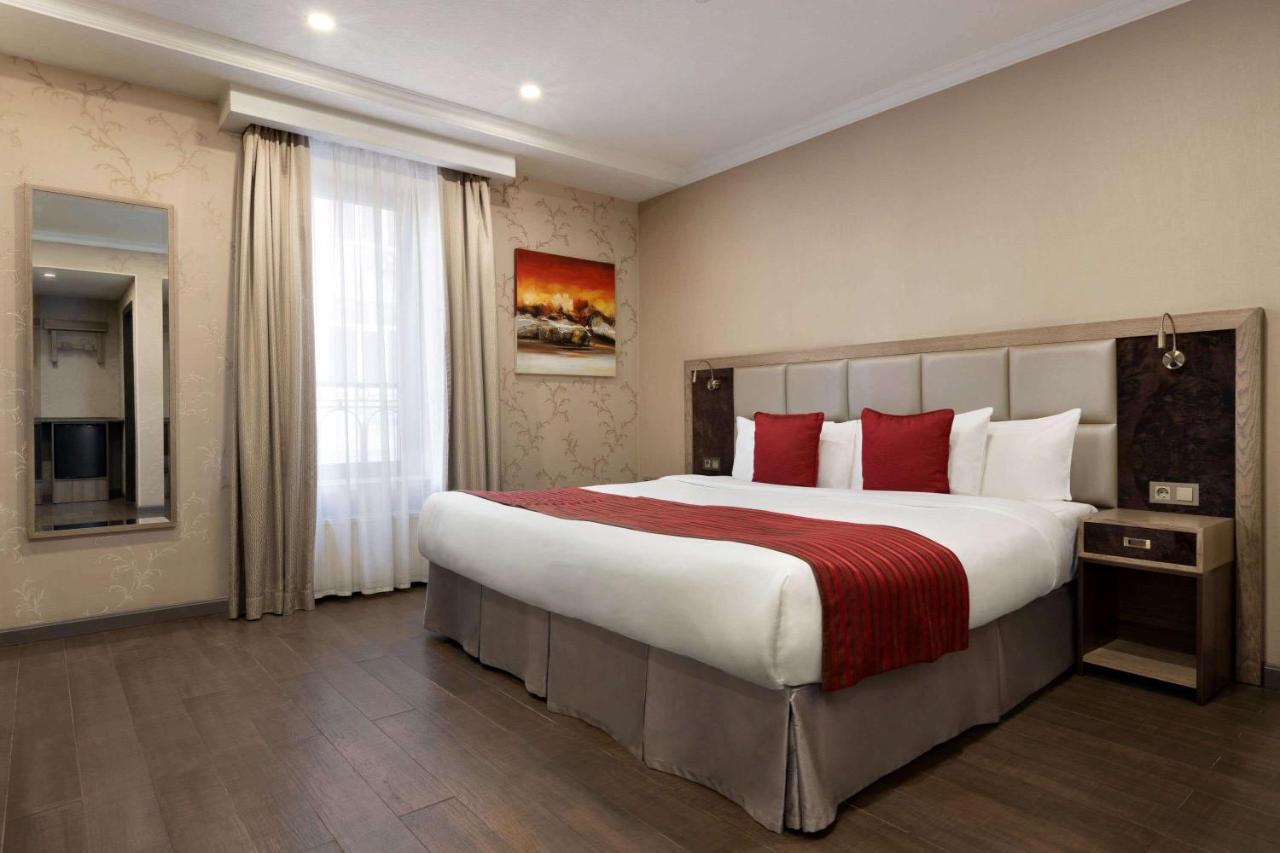 Ramada By Wyndham Bishkek Centre Hotel Exterior photo