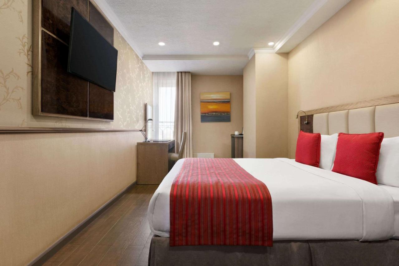 Ramada By Wyndham Bishkek Centre Hotel Exterior photo
