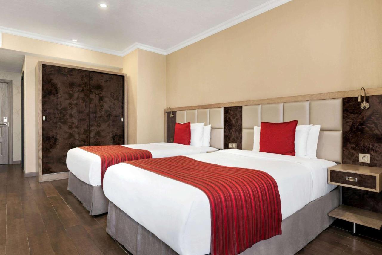 Ramada By Wyndham Bishkek Centre Hotel Exterior photo