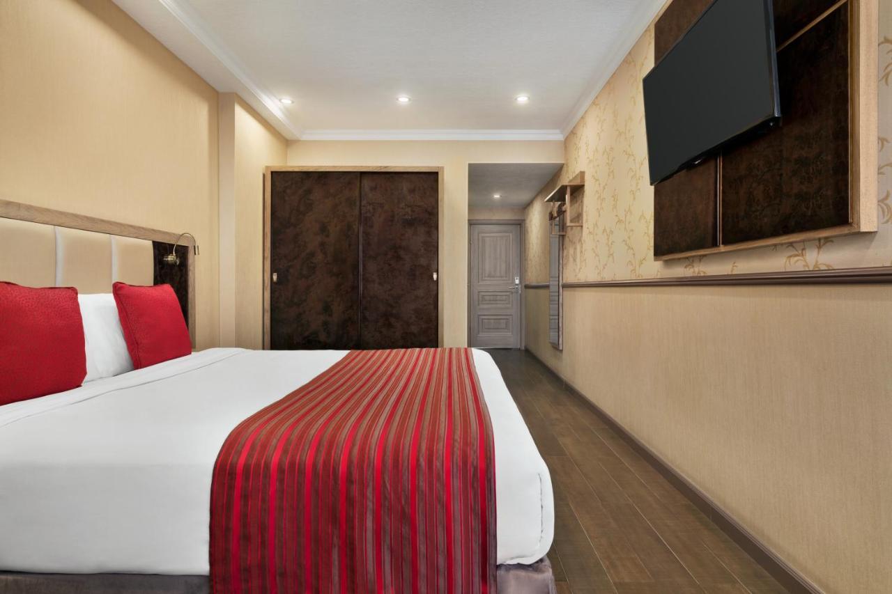 Ramada By Wyndham Bishkek Centre Hotel Exterior photo