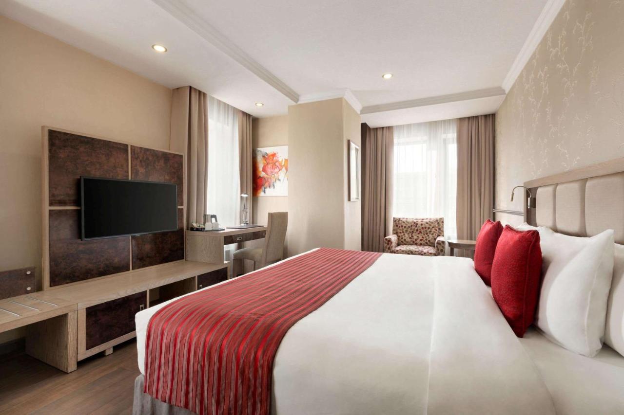 Ramada By Wyndham Bishkek Centre Hotel Exterior photo